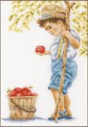 Niño con manzanas
